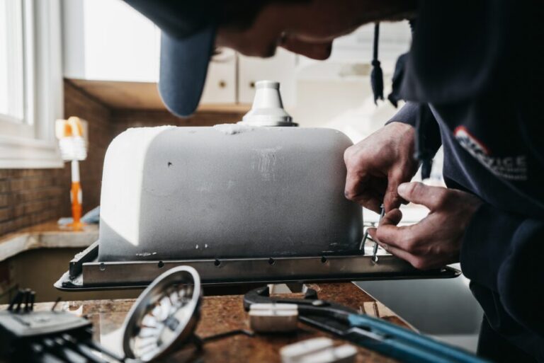 Licensed plumber performing plumbing and heating inspection in Saskatoon, Canada.